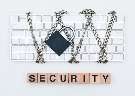 privacy page header image showing computer keyboard securely wrapped in a padlocked chain