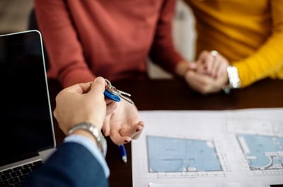 how to screen tenants header image of couple being approved for rental and getting keys
