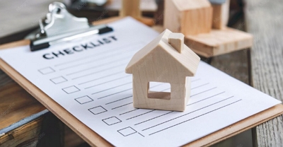 tenant screening checklist header image of model home sitting on top of paper checklist